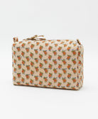 cosmetic travel bag in a sand, orange & olive floral print with blue hand-stitched kantha embroidery