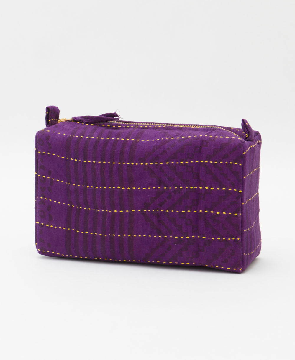 cosmetic travel bag in a subtle purple stripe print with yellow hand-stitched kantha embroidery