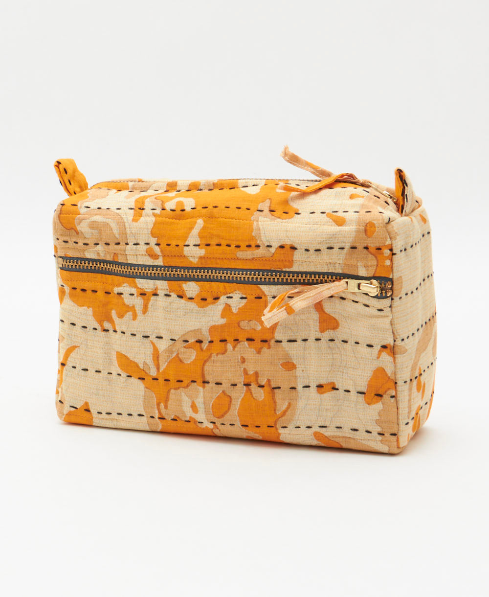 light orange medium toiletry bag in sandy ivory abstract print handmade in India by women artisans