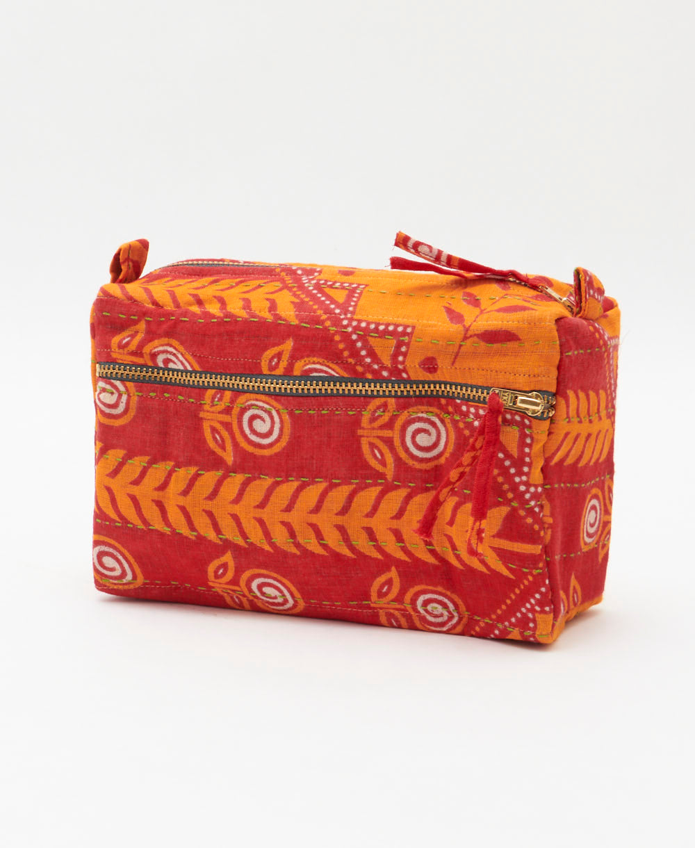 red medium toiletry bag with orange leaf print handmade in India from vintage cotton saris by women artisans