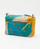 teal medium toiletry bag in golden yellow colorblock print with tiny flowers handmade in India by women artisans