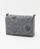 eco-friendly cosmetic travel bag in a slate blue floral print made by women artisans in India