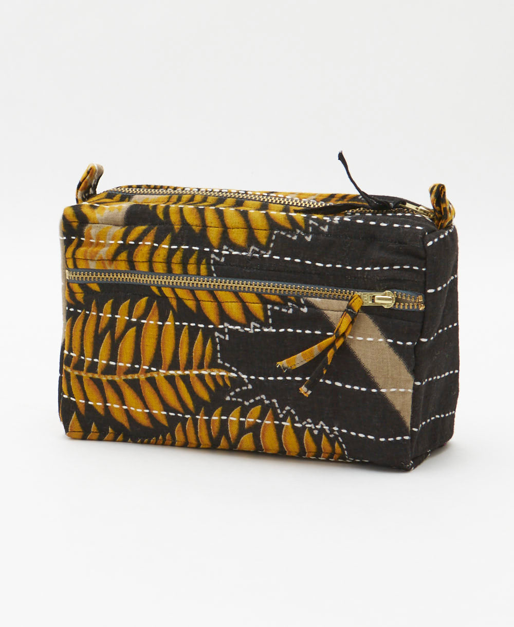 black medium toiletry bag in a golden fern print handmade from upcycled vintage cotton fabrics in India