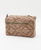 southwestern print medium toiletry bag in sandy beige hues with pink hand-stitched embroidery