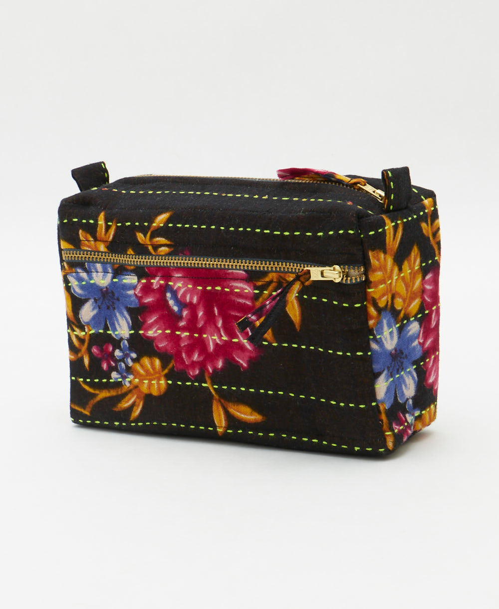 black medium toiletry bag with hot pink and golden floral design with neon green hand-stiched embroidery