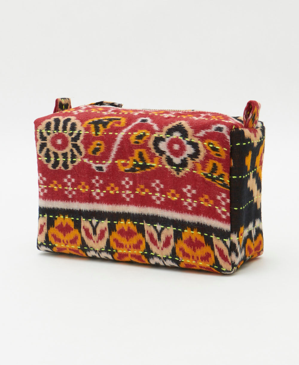 unique cosmetic travel bag in a vintage black and orange geometric southwestern print