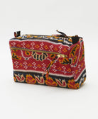 red medium toiletry bag with black and orange geometric floral print handmade from cotton saris in India