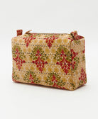 sustainable cosmetic travel bag in a red, hunter green and golden yellow floral print