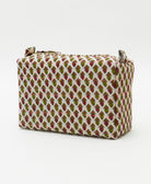 white cosmetic travel bag in red and olive tiny floral print handmade from vintage cotton saris