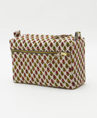 white medium toiletry bag with tiny flowers in olive green and dark red with neon pink kantha embroidery