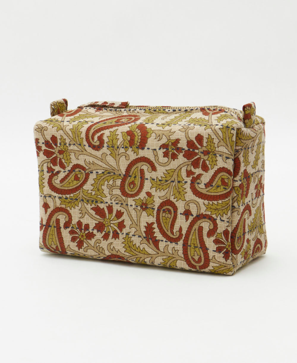 light grey cosmetic travel bag in a rust and sage paisley pattern handmade in India by women artisans