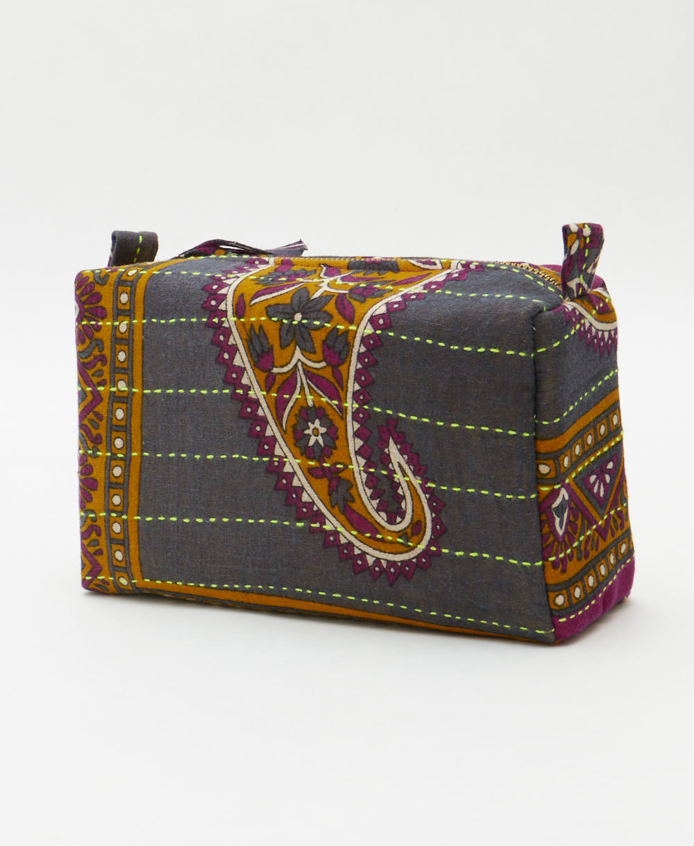 geometric stipe cosmetic travel bag in magenta purple and marigold with neon green embroidery