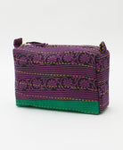 sustainable cosmetic travel bag in eggplant purple with bright yellow embroidery