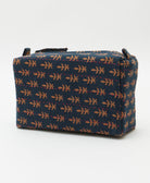 navy cosmetic travel bag with coral leaf pattern and hot pink hand-stitched embroidery with 2 zippers