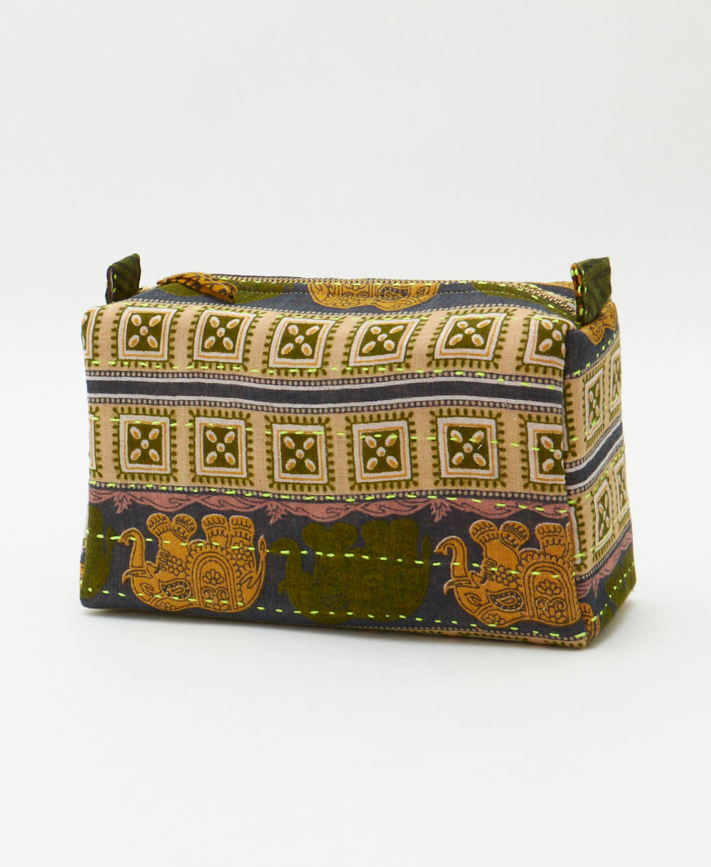 cosmetic travel bag embroidered with neon green stitching with a golden elephant print