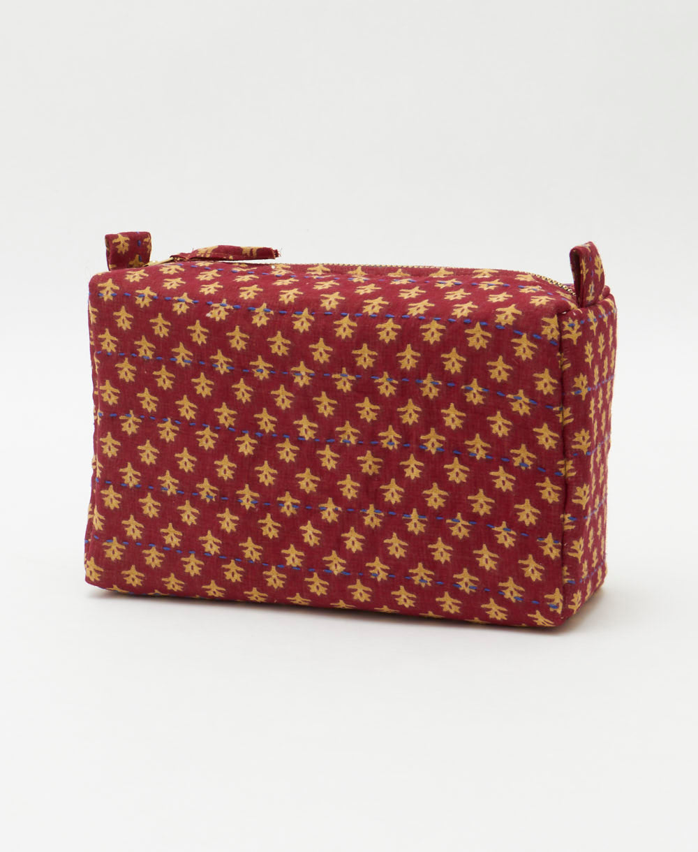 maroon cosmetic travel bag with small beige floral print handmade by women artisans from vintage fabrics