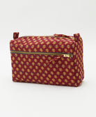 dark red medium toiletry bag with tiny beige floral print and blue hand-stitched embroidery