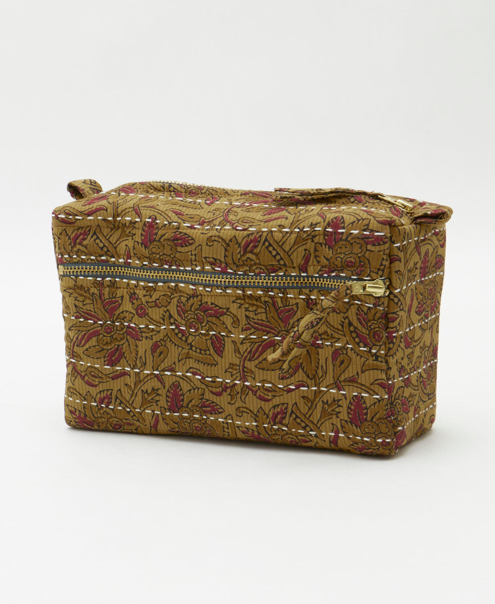 light brown medium toiletry bag with subtle maroon paisley pattern handmade by artisans in India from vintage saris