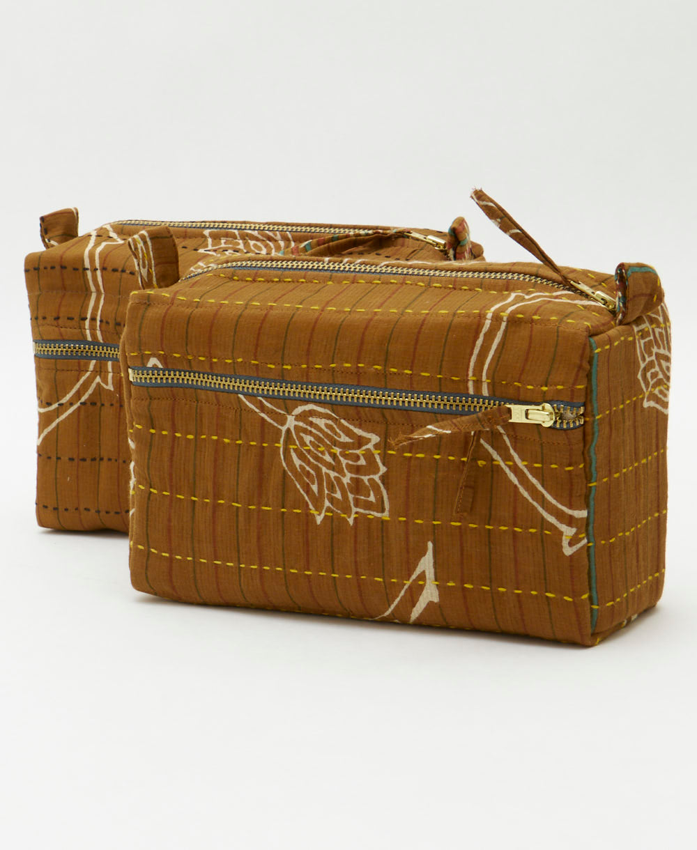 unique camel toiletry bags with different colored hand-stitched embroidery made from upcycled vintage cotton saris