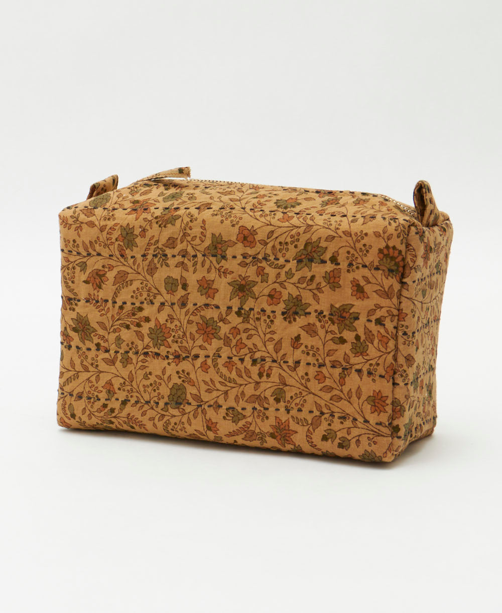 woodsy floral cosmetic travel bag in light brown, hunter green and peach