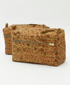 sustainable toiletry bags in light brown floral with different colored embroidery