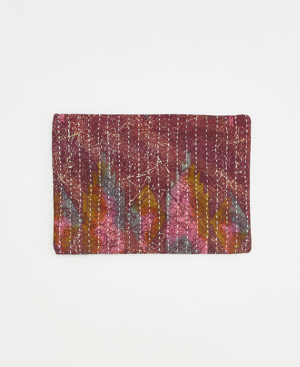 embroidered pouch with brown and purple abstract print with white stitching