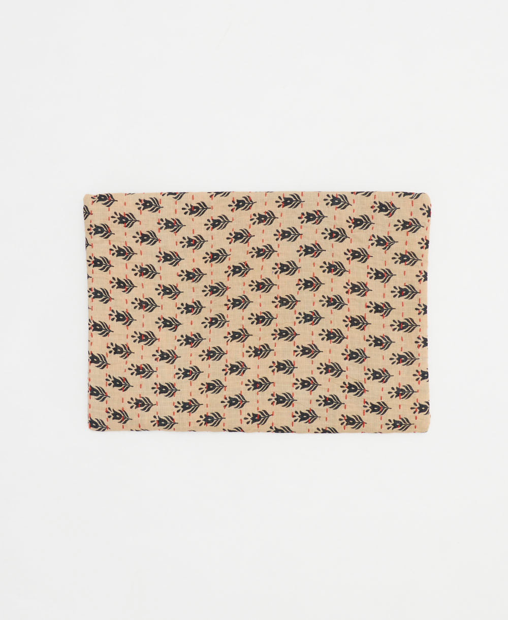 eco-friendly small zipper pouch in light tan with black tulip print and red kantha stitching