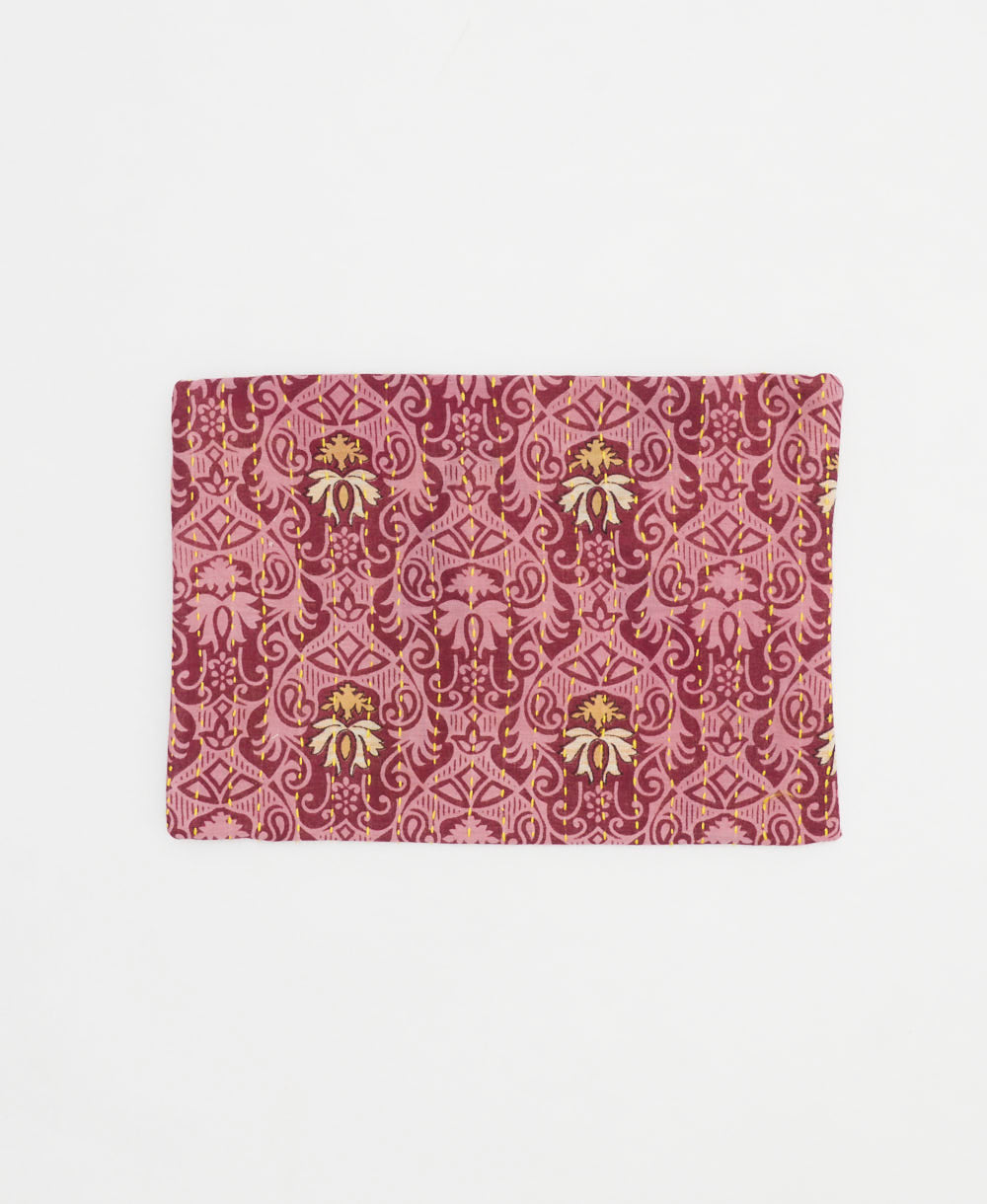 small zipper pouch in pink and reddish purple swirl print handmade by women artisans in India