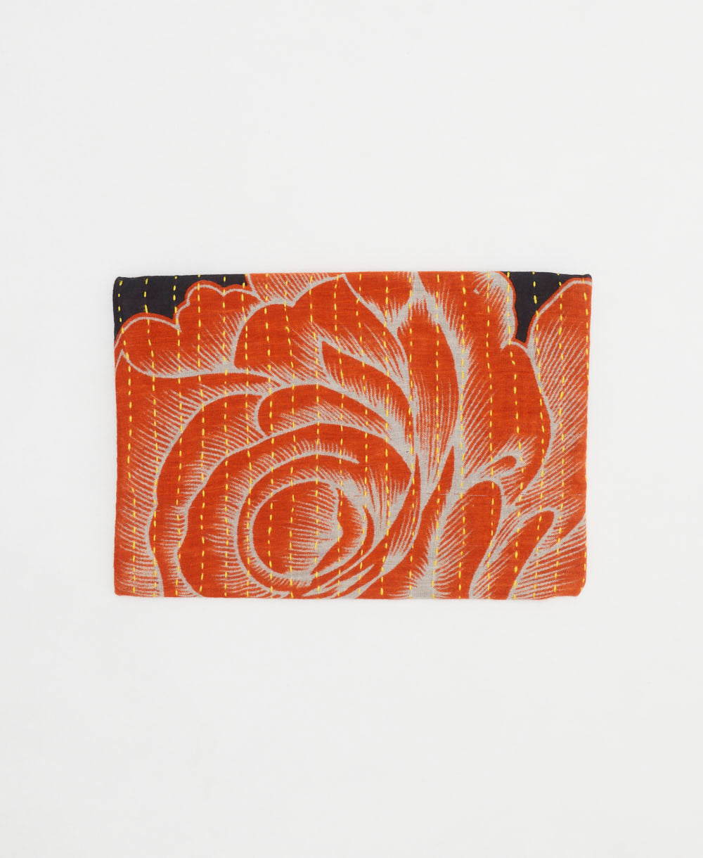 small zipper pouch in orange and black oversized abstract floral print with yellow kantha stitching