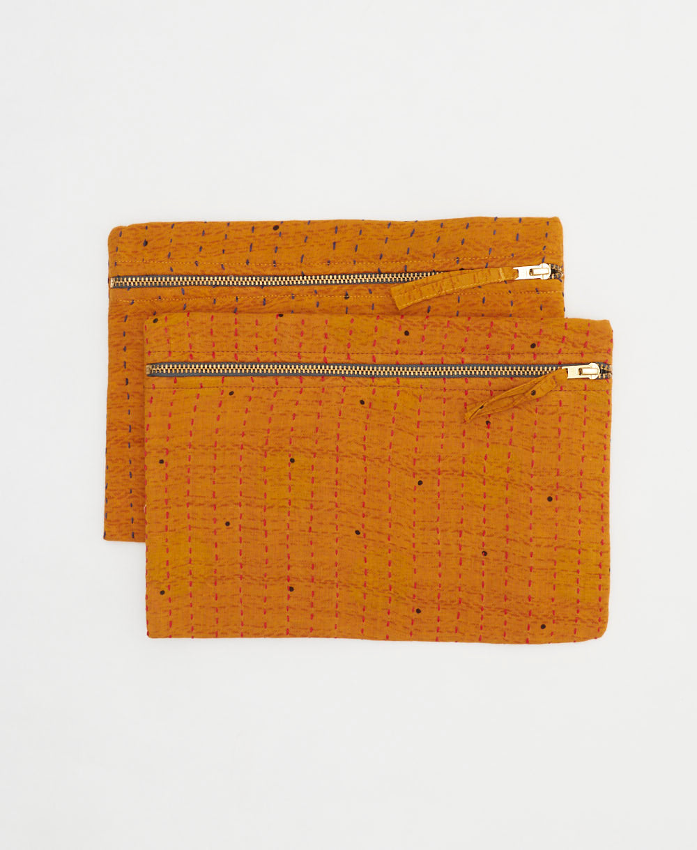 eco-friendly pouches made from one-of-a-kind vinage saris in orange and black polka dot print