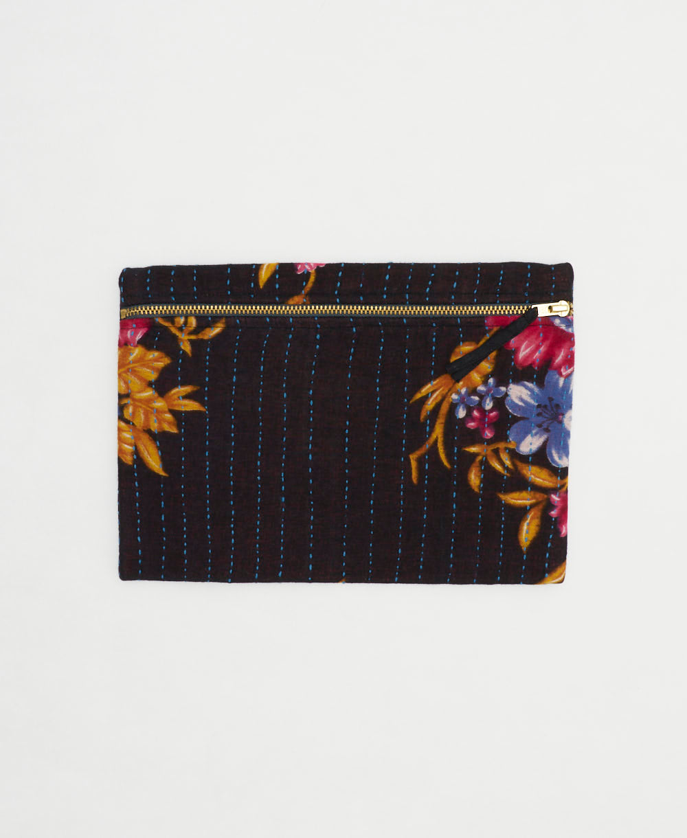 black small pouch with golden yellow, hot pink and blue floral print abd blue hand-stitched embroidery