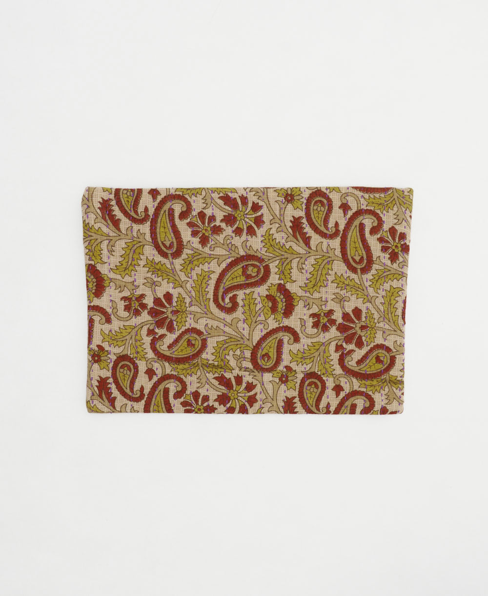 small zipper pouch in olive green and brick red paisley handmade by women artisans