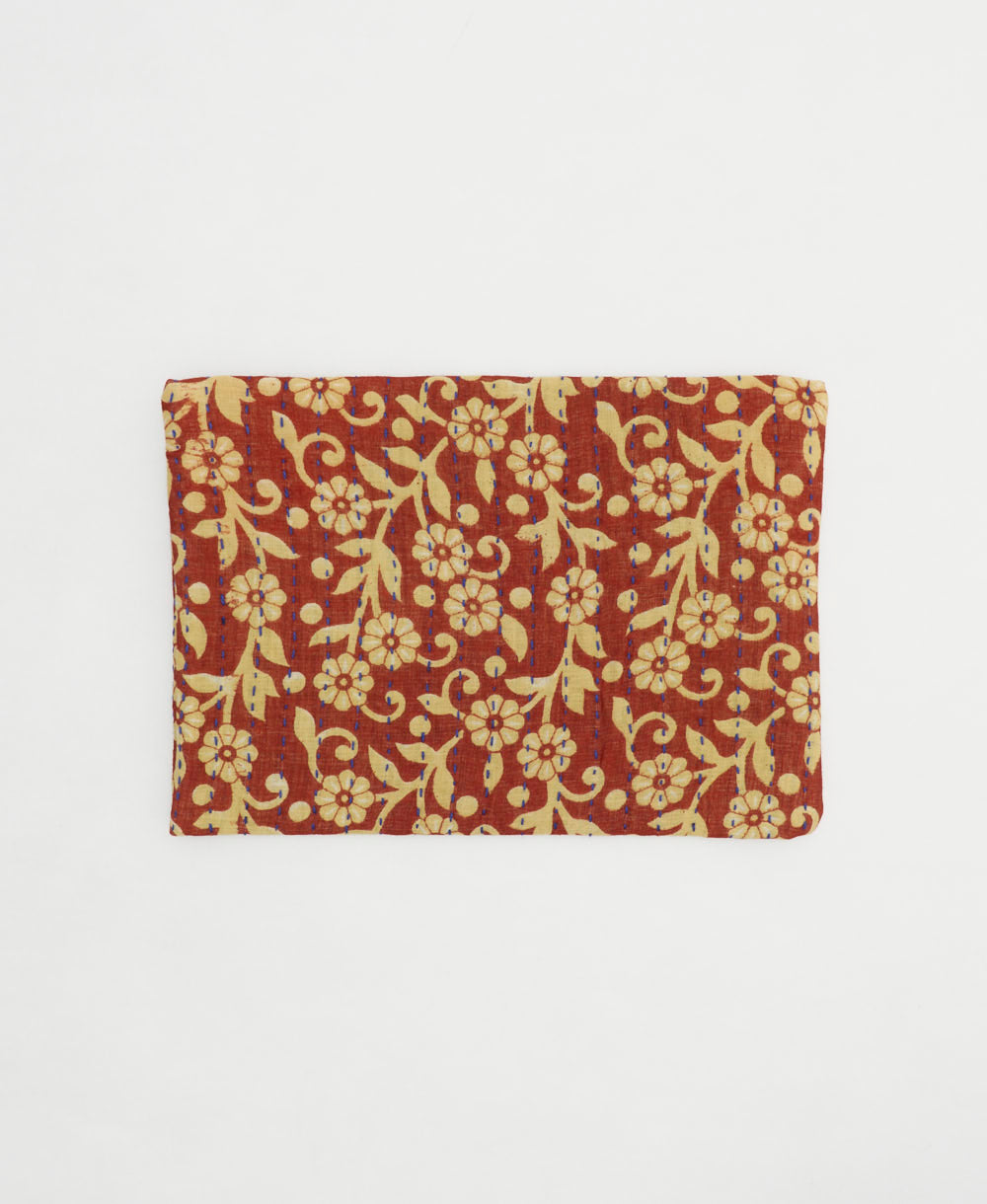 red small zipper pouch in beige daisy pattern handmae by women artisans