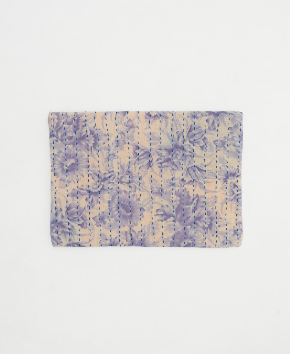 small zipper pouch in a lavender floral print with bold kantha stitching handmade by women artisans in India