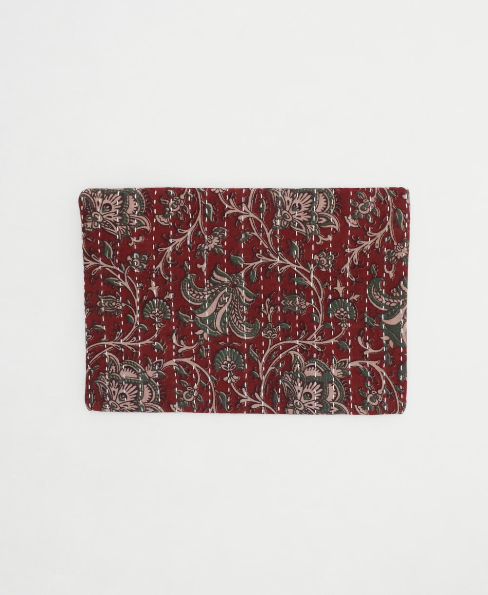 small zipper pouch in burgundy-red and muted green floral vine print made by women artisans in India