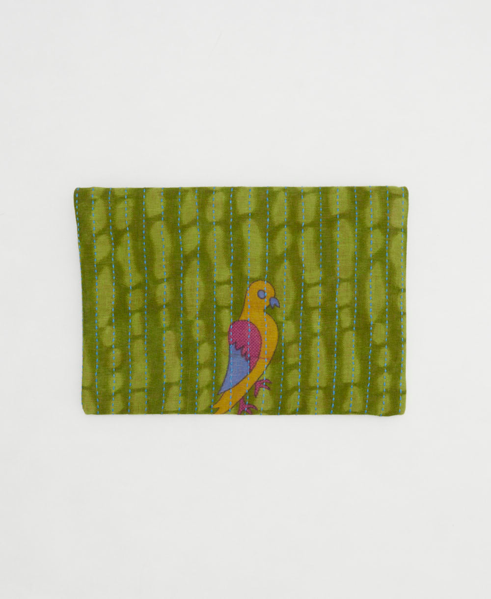 small zipper pouch with hand-stitched embroidery in unique bohemian vintage fabric