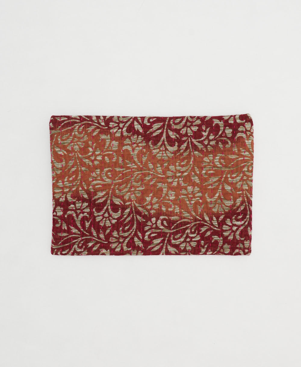 small zipper pouch with hand-stitched embroidery in unique bohemian vintage fabric