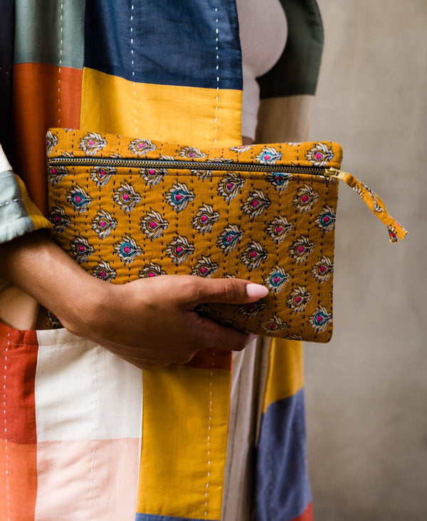 ethically made clutch lined with canvas, hand-embroidered and made from upcycled vintage cotton