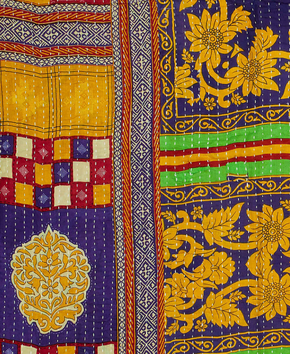 Kantha quilt throw featuring purple, yellow, and red traditional kantha hand stitching