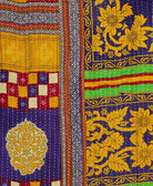 Kantha quilt throw featuring purple, yellow, and red traditional kantha hand stitching