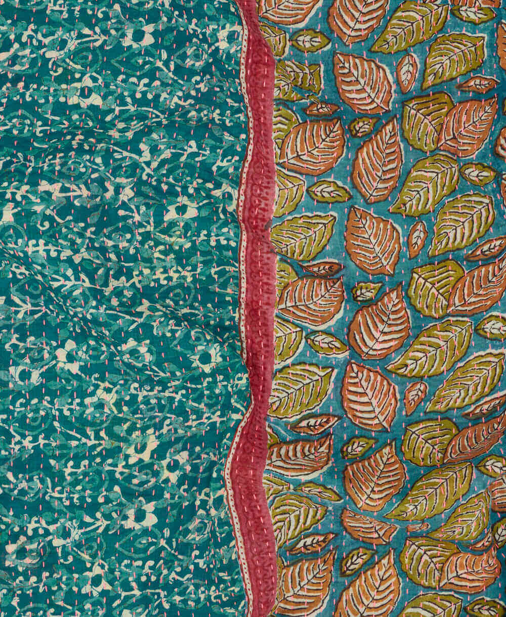 french Blue kantha quilt throw with a tag featuring the hand-stitched signature of the maker