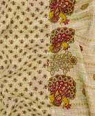 forest green bird print kantha quilt throw with a tag featuring the hand-stitched signature of the maker