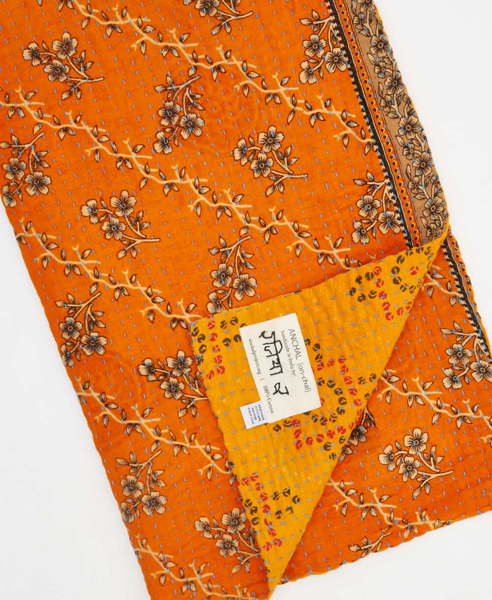 saffron geometric Kantha quilt throw made of recycled vintage saris