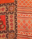 Kantha quilt throw featuring bright orange diamond print & blue traditional kantha hand stitching