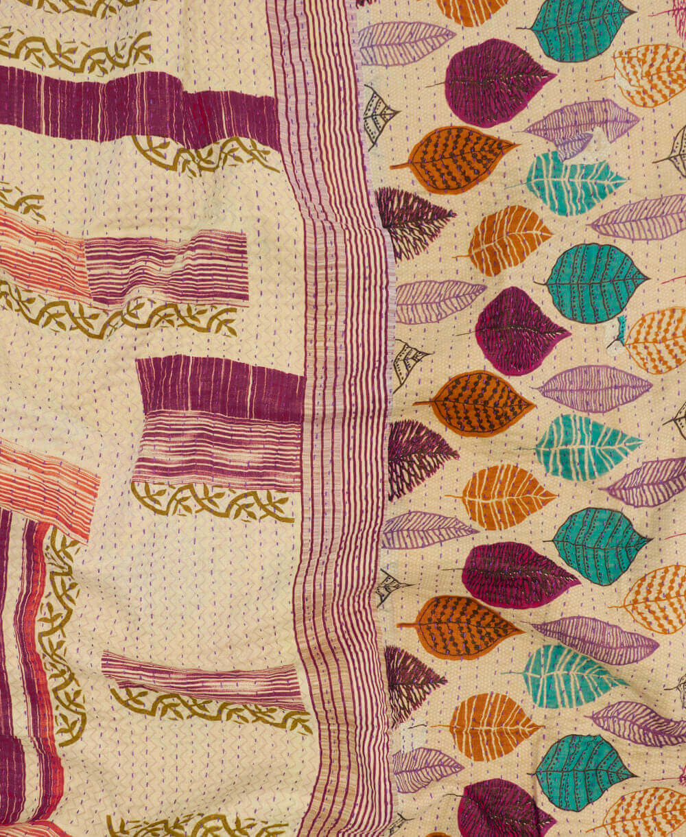 Kantha quilt throw featuring orange & purple leaf print & purple traditional kantha hand stitching