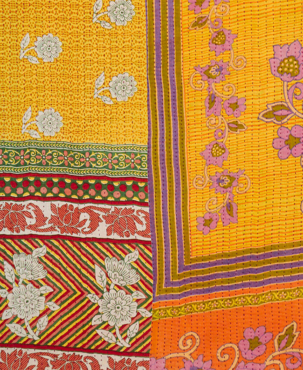 marigold yellow floral Kantha quilt throw made of recycled vintage saris in India by all women artisans