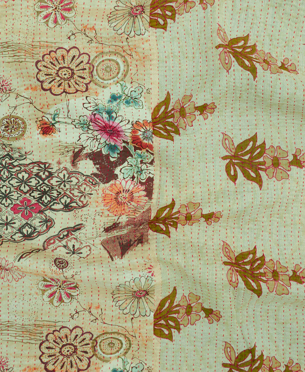 Kantha quilt throw featuring sage green abstract floral print & red traditional kantha hand stitching