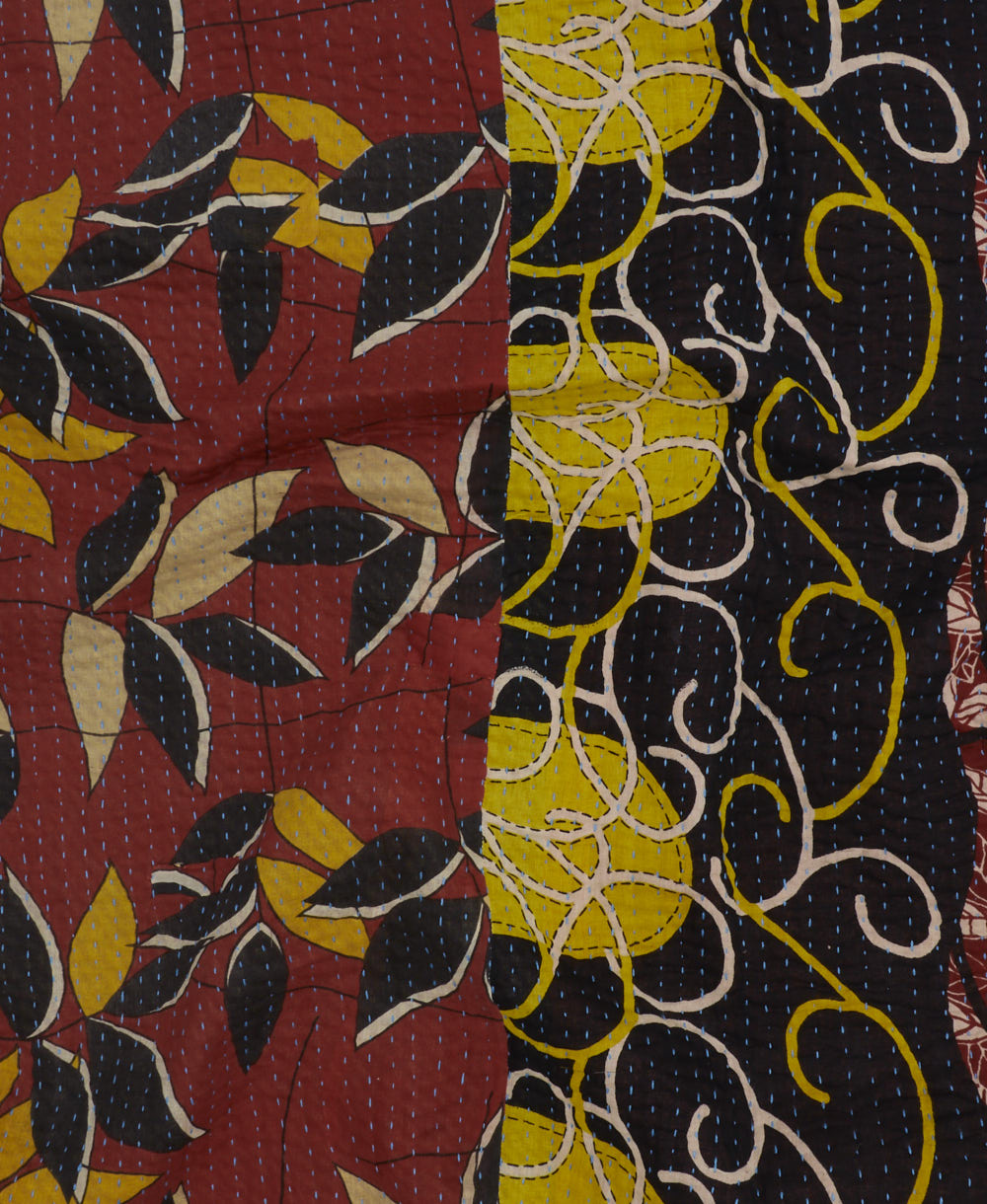 Kantha quilt throw featuring yellow traditional kantha hand stitching in a red, black & mustard abstract print