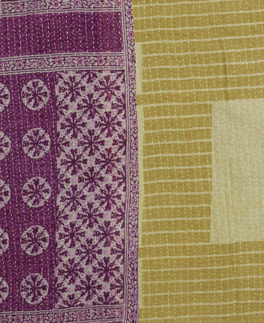 orchid purple & white medallion kantha quilt throw with a tag featuring the hand-stitched signature of the maker