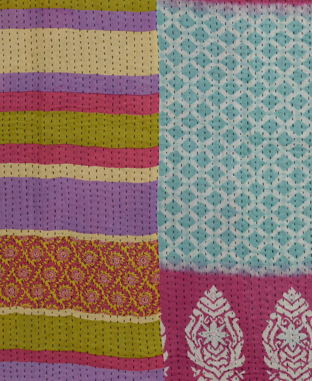 bubblegum pink, purple & lime stripe kantha quilt throw with a tag featuring the hand-stitched signature of the maker